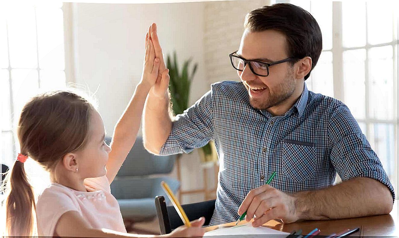 Father gives daughter high five