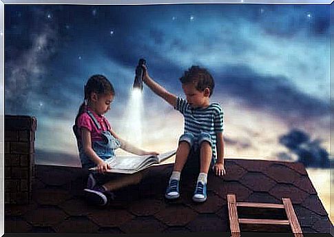 children reading on a roof