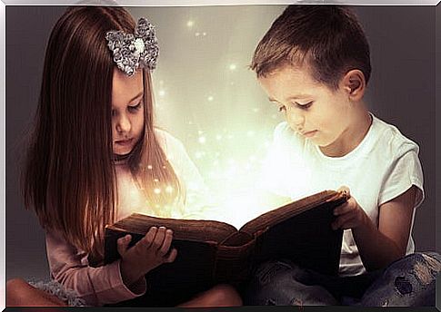 two children reading a magic book