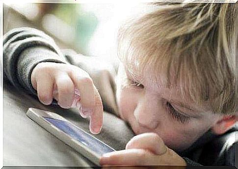 little boy using a smartphone