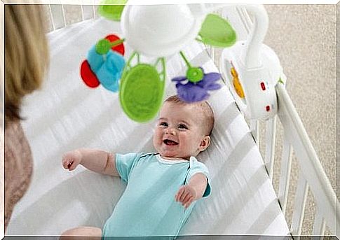 Happy baby with toys