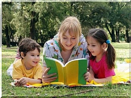 Woman reading story to children