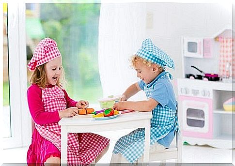 Two children playing kitchen