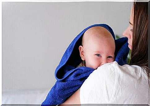 baby wrapped in towel