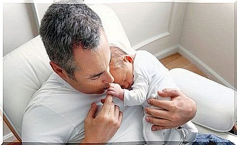 baby in father's arms