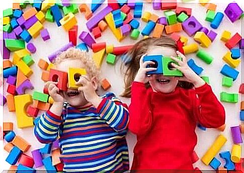 Children play with building blocks