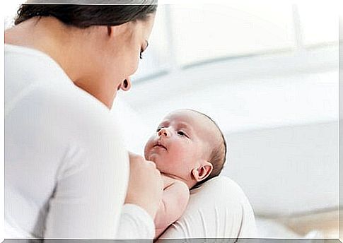 Mother talks to her baby