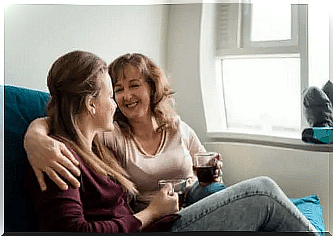 Mother and daughter with a cup of coffee