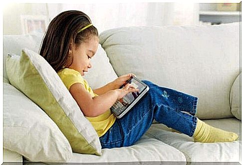 girl playing on tablet