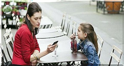 mother is more busy typing on her phone than spending time with her daughter