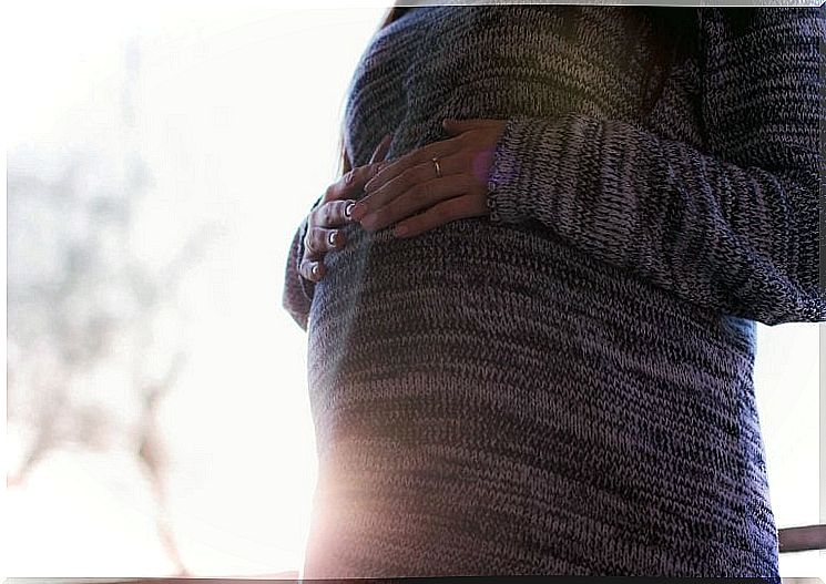 pregnant woman in knit sweater