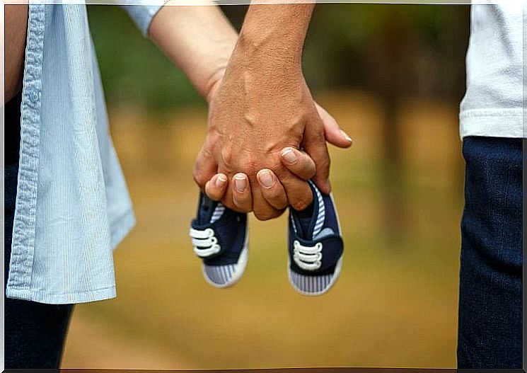 a pair of braids around a pair of children's shoes