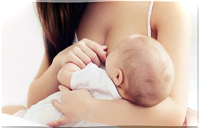 Mother breastfeeds baby as part of caring for newborns