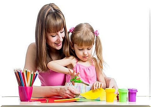 mom helping girl cut