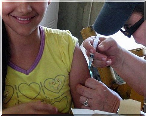 Happy child being vaccinated