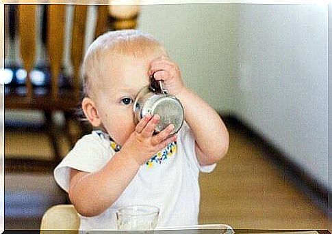 baby drinking from cup