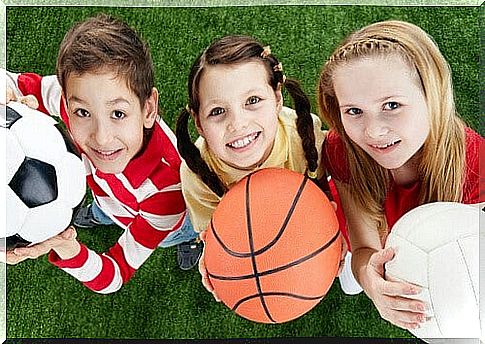 three children holding different balls