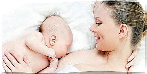 mother breastfeeds her baby